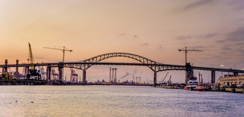 The Los Angeles port with the St Thomas bridge against a sunset  