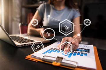 Businessman using mobile phone and laptop computer on white desk big data analytics with business intelligence concept. with VR  icon
