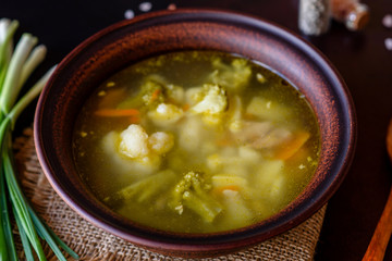 Fresh vegan soup with broccoli, cauliflower, asparagus and carrots