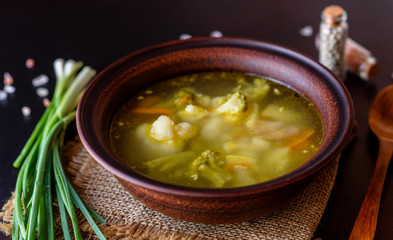 Fresh vegan soup with broccoli, cauliflower, asparagus and carrots