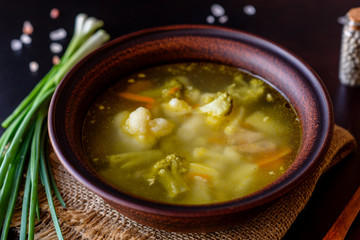 Fresh vegan soup with broccoli, cauliflower, asparagus and carrots