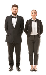 Male and female waiters on white background