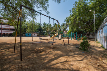 Empty playground at urban school in India