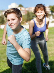 Obraz premium Mother and son running together