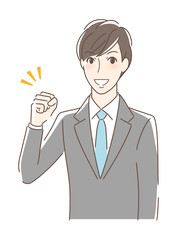 ガッツポーズする男性