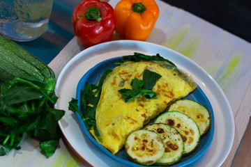 Tortilla with egg, spinach, zucchini and peppers for ketogenic diet.