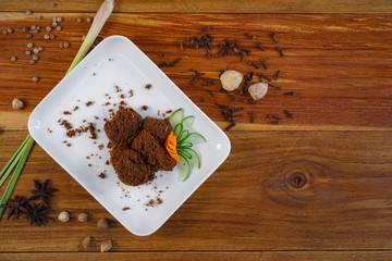 Beef Rendang Padang Food, Famous Indonesian Food, The popular Padangnese or West Sumatran dish of spicy beef stew. Flat Lay Right.
