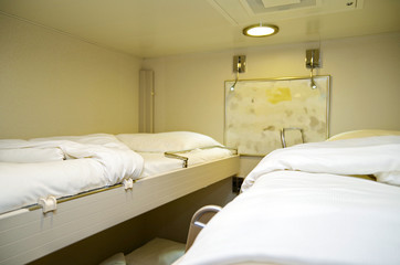 Interior stateroom or inside cabin on modern cruiseship or cruise ship liner with bunk beds