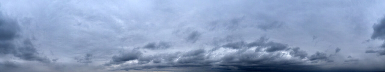 Fototapeta na wymiar Panorama of cloudy gray sky. Sky rainstorm