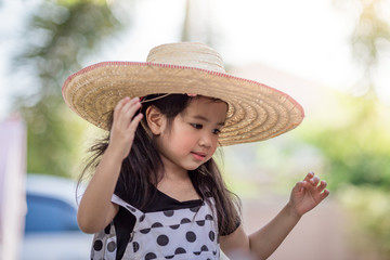 Close-up background view of a cute girl who is watering plants or growing vegetables for health,a crop cultivation program and business expansion