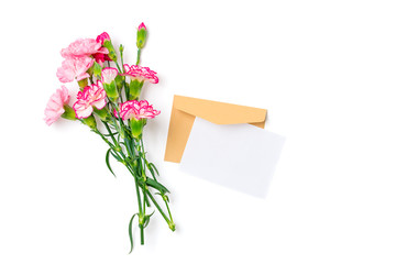 colorful bouquet of different pink carnation flowers, craft envelope, paper isolated on white background Top view Flat lay Holiday card 8 March, Happy Valentine's day, Mother's day concept Mock up