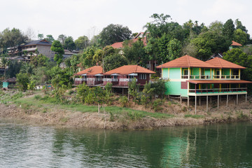 Fototapeta na wymiar lakeside houses, hostels or resorts and forest