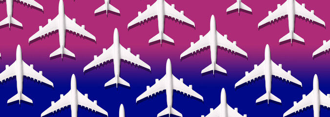 Summer pattern. Creative banner of white planes on blue, pink background. Travel, vacation concept. Travel, vacation ban. Flights cancelled and resumed again. Top view. Flat lay. Minimal style design.