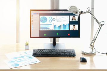 Close-up Of Business Video Conferencing On Laptop At Desk In Office