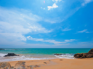 Fototapeta na wymiar Uninhabited tropical beach with blue sky