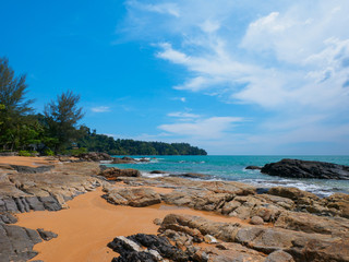 Fototapeta na wymiar Uninhabited tropical rocky beach with blue sky