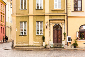 Fototapeta na wymiar Entrance to the medieval house in the Old Town. Winter season in Warsaw, Poland.