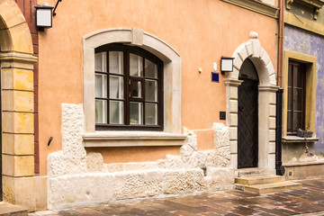 Entrance to the medieval house in the Old Town. Winter season in Warsaw, Poland.
