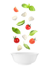 Mozzarella cheese balls, tomatoes and basil leaves falling into bowl on white background. Caprese salad