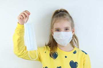 Glad and happy beautiful joy,child in the medical helthcare guarding or protecting mask and in...