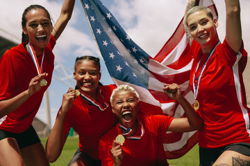 American woman soccer team celebrating championship victory.