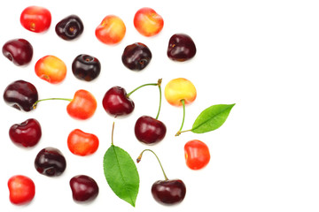 red and yellow cherry with green leaf isolated on white background. Top view