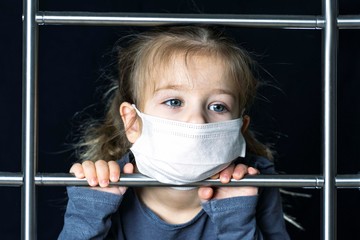 A little girl in a mask climbs the stairs. moving up to success
