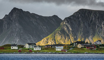 cloudy sky in summer with warm or cold sunset light in norway