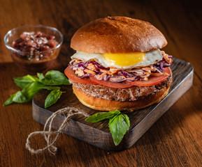 tasty burger with fried egg and beef