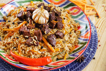 Pilaf with mutton, carrots, onions, garlic, pepper and cumin. A traditional dish of Asian cuisine.
