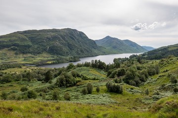 Fototapeta na wymiar Landscape of Scottish nature, green hills and Loch Shiel lake near Glenfinnan lookout in Scotland
