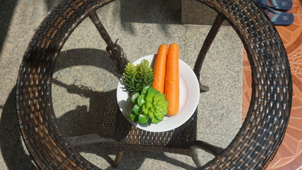 Carrots on the table glass