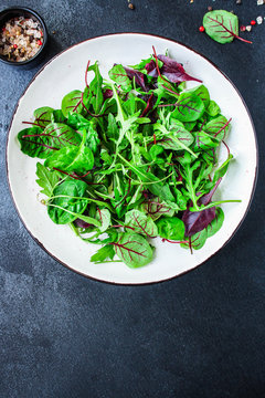 Healthy salad, leaves mix salad (mix micro greens, juicy snack) keto or paleo menu recipe. food background, copy space for text