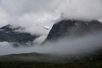 Morning mist is rising towards the top of Duolbagorni peak and Kebnekeise in Sweden Lapland
