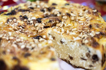 macaroni pudding with cheese, raisins, egg with hazelnuts on top macaroni pudding with cheese and egg with hazelnuts on top
