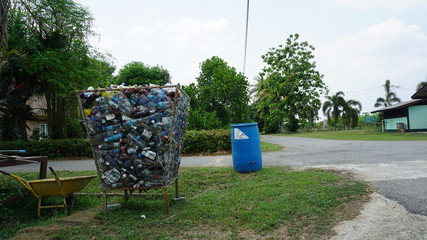 Bucket for collecting plastic waste bottles