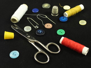 Fototapeta na wymiar Sewing Needle thread scissors thimble tailor buttons