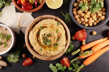 hummus, olive and sauce with vegetable
