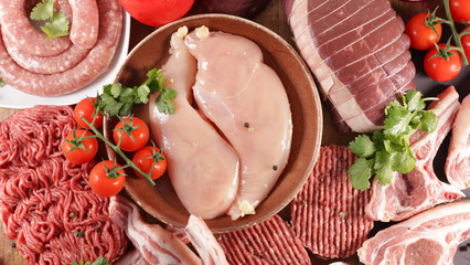 assorted of raw meats- chicken, beef, sausage, lamb © M.studio