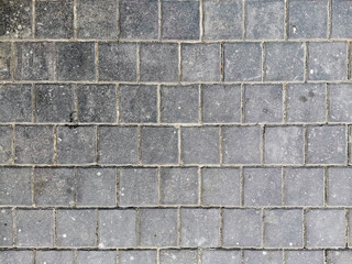 Grey brick wall in close up background