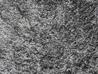 A fluffy gray plaid made of thread.