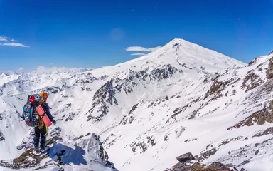 Fotobehang skier on the top of mountain Elbrus mountain landscape © Alex