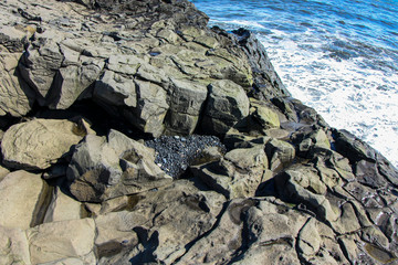 Beautiful basalt cliff on the ocean in southern Iceland