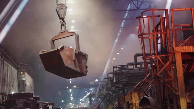 Steel Works. A huge crane transports the ladle of molten metal.