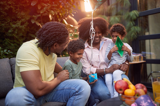 Afro-American family enjoying together, playing, talking, smiling, having fun. Family, togetherness concept