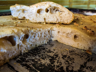 Freshly cut focaccia with garlic and rosemary