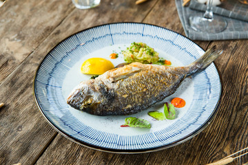 Closeup on delicious gourmet grilled roasted fish