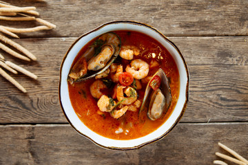 Top view on asian thai tom yam seafood soup