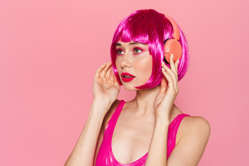 Image of serious pretty woman posing in wireless headphones