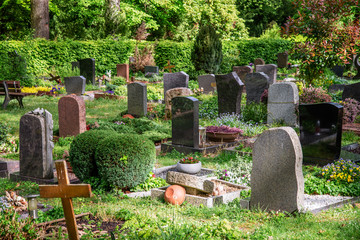 Graves with gravestones in a cemetery